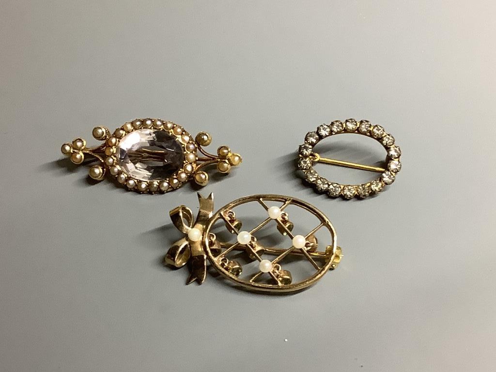 Seven items of assorted jewellery including a 15ct, rock crystal and seed pearl set brooch, 37mm, gross 5.2 grams, a 14ct & enamel semaphore brooch, gross 6.4 grams, a mourning brooch and bracelet and a 9ct gold and gem